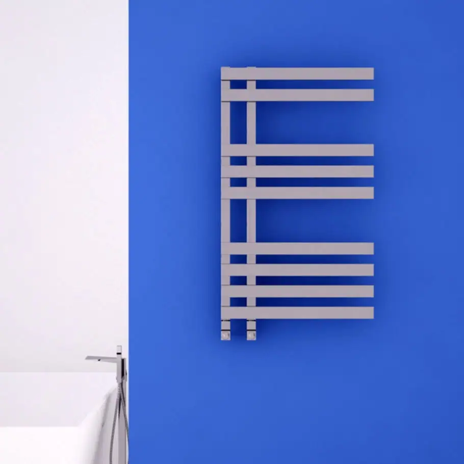 CARISA VERONA HEATED TOWEL RAIL Modern towel radiator mounted on a vibrant blue wall at Poshrads, offering stylish heating solutions.