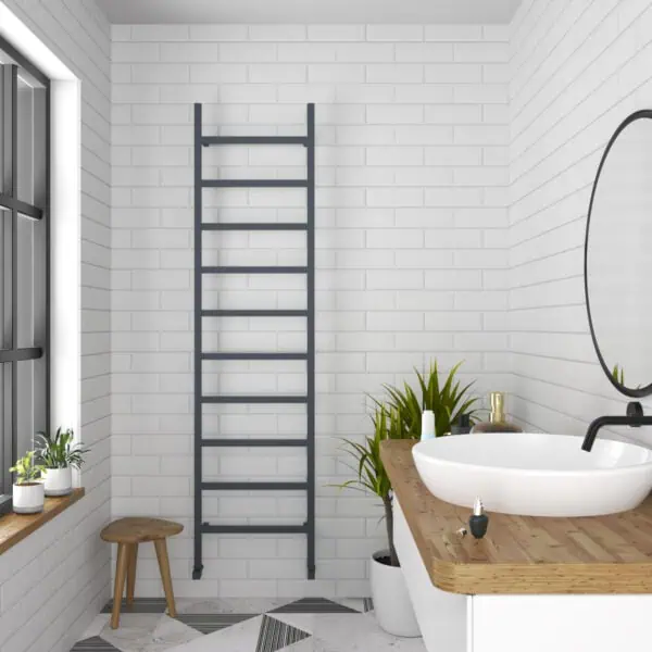 Modern minimal bathroom with white brick walls and a black towel radiator.