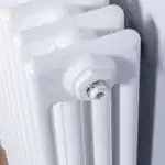 Radiator with valve close-up showing efficient heating system for home comfort.