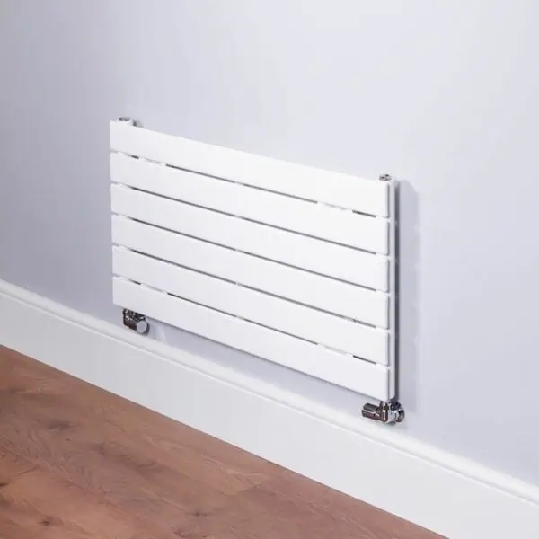 Radiator, modern white wall-mounted radiator for home heating, sleek design, efficient heater for living room and bedrooms, easy to install and maintain, energy-saving heating system.