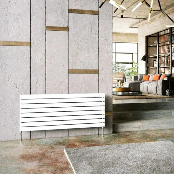 Modern minimalist white radiator in stylish living room with concrete wall and cozy seating area, eco-friendly heating solution.