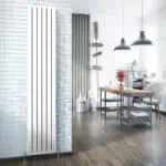 Modern industrial interior with white brick walls, stylish lighting, and wooden accents in a cozy living space.