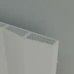 Modern white radiator with intricate grille design, ideal for contemporary heating solutions.