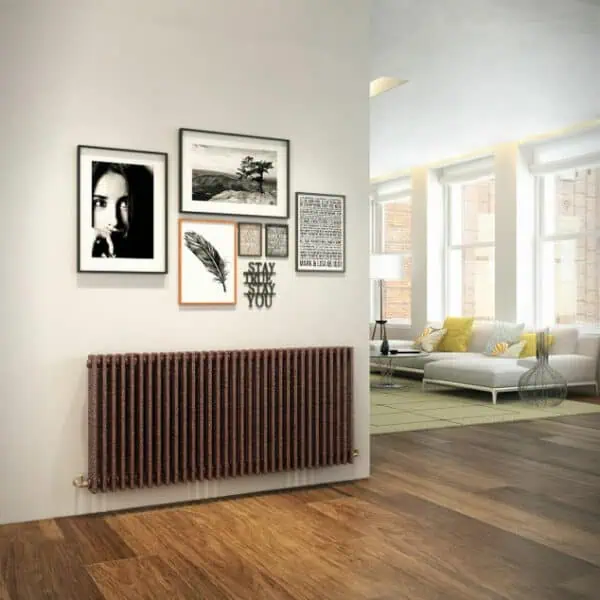 Modern living room interior with stylish wall art and radiator, bright natural light, cozy sofa, and contemporary decor.