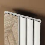 Radiator with modern white panels in a sleek interior setting.