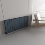 Radiator and wooden chair in modern minimalist interior design.