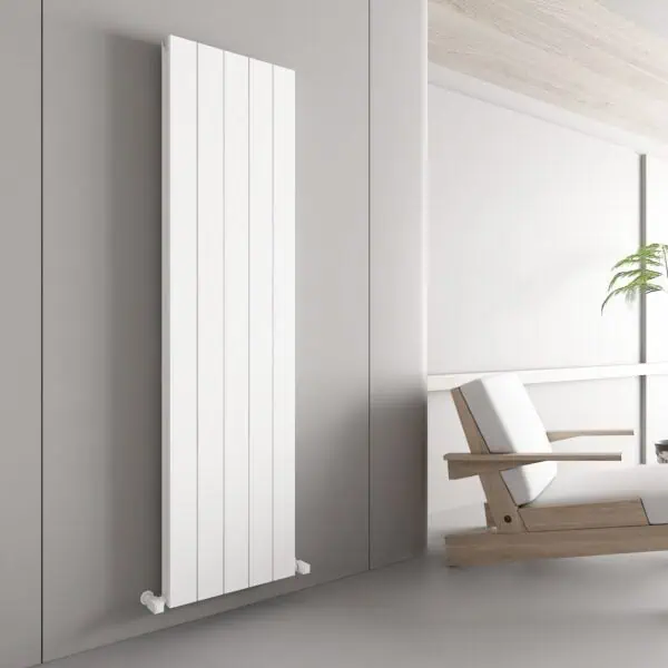 Minimalist white vertical radiator in a modern home interior.