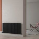 Radiator with modern black design in minimalist interior decor.