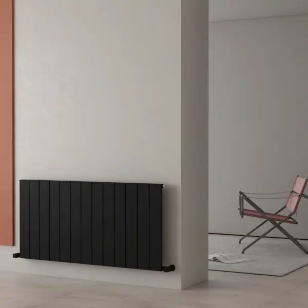 Radiator with modern black design in minimalist interior decor.