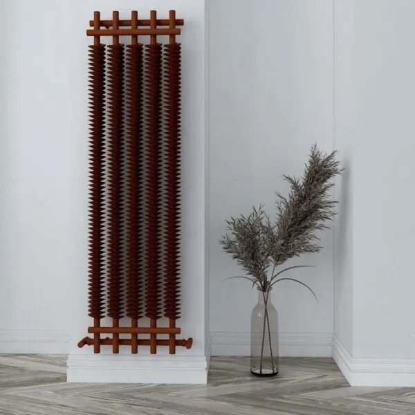 Rust-colored modern radiator with wood accents, next to a tall glass vase with dried pampas grass.
