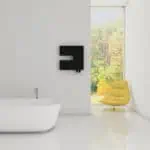 Modern minimalist bathroom with black wall-mounted heater, white bathtub, and yellow accent chair near large window.