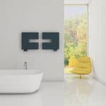 Minimalist bathroom with modern bathtub and decorative wall art, bright space with large window and yellow chair.