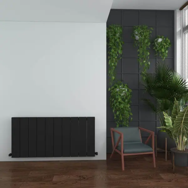 Modern interior with black radiator and lush green plant decor, stylish living space design.
