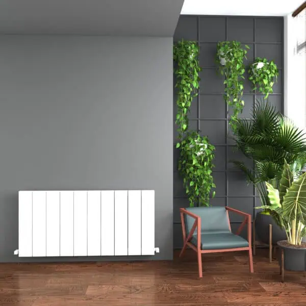 Vibrant indoor plant wall with potted greenery and modern chair in stylish living space.