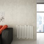 Modern white vertical radiator in minimalist interior setting for stylish home heating solutions.