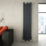 Sleek modern black radiator in contemporary living room with city view.