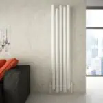 Modern vertical white radiator in contemporary living space.