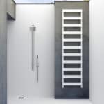 Modern outdoor shower with rain shower head and sleek design.
