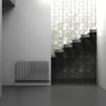 Modern minimalist interior with staircase and textured brick wall design.