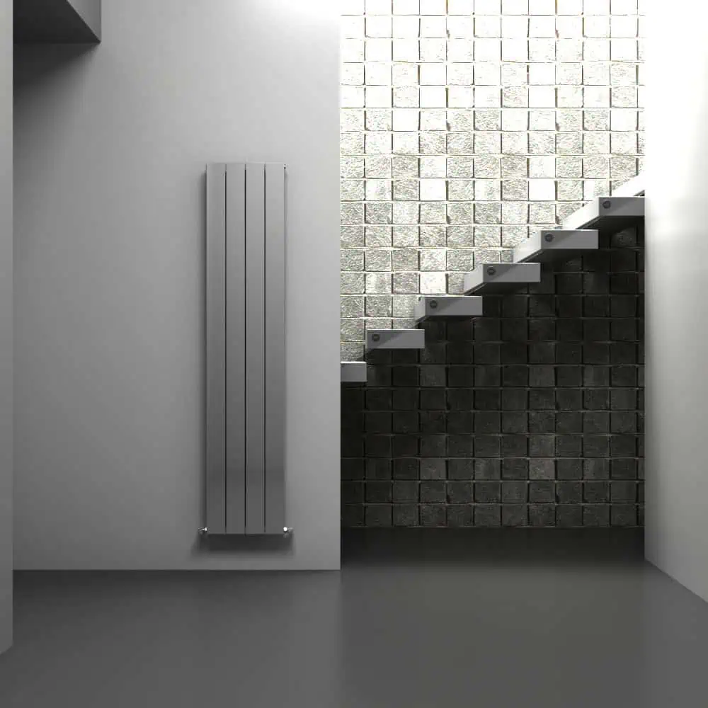 NMD 1800X0375X4 PLS-NEW Radiator mounted on white wall with textured black and white brick wall background, modern minimalist interior design.