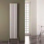 Radiator heating panel in modern interior, minimalistic home decor, wall-mounted vertical radiator for efficient heat distribution, stylish heating solution.