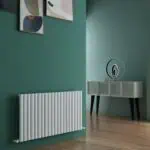 Radiator and modern decor in stylish living room interior.