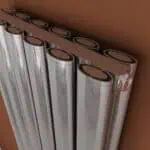 Polished vertical radiators in a modern heating system.