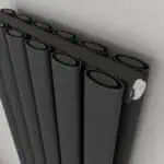 Black modern towel radiator heating unit for home or office heating.