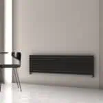 Radiator heating system in modern minimalist interior room, black wall panel radiator design, energy-efficient home heating, black radiator elegance, sleek heating solution.