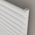 Aluminum louver radiators with white fins for efficient room heating.