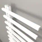 White flat-panel radiators for modern heating solutions in homes and offices.