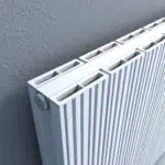 Modern white vertical panel radiator for central heating.