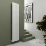 Vertical modern white radiator in contemporary interior design.