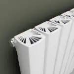 Radiator heat vent cover installation for efficient heating system.