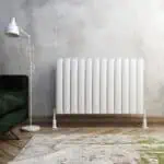 White modern radiator in a contemporary living room setting.