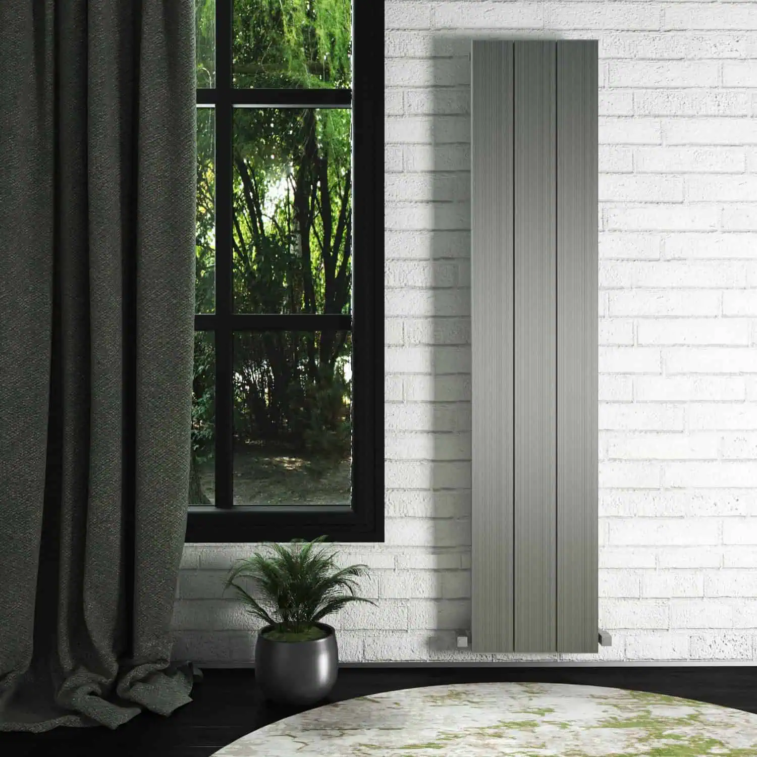 elvino 375x1800 pls-min Modern vertical grey radiator in a minimalist interior setting with a large window and greenery outside.
