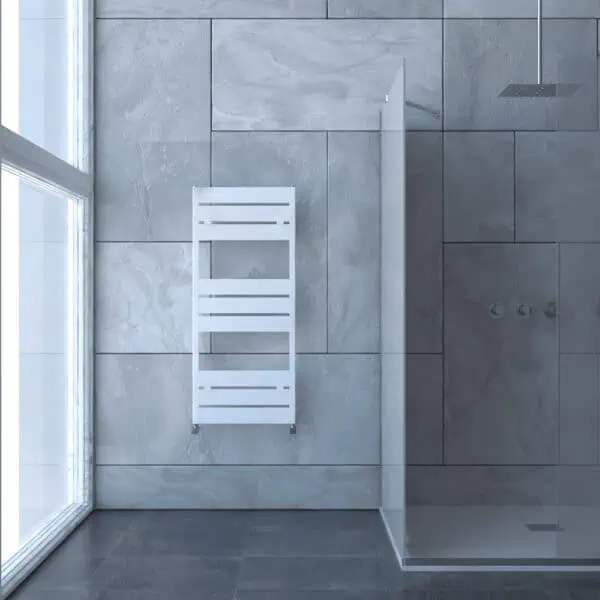 White modern towel radiator in a contemporary bathroom setting.