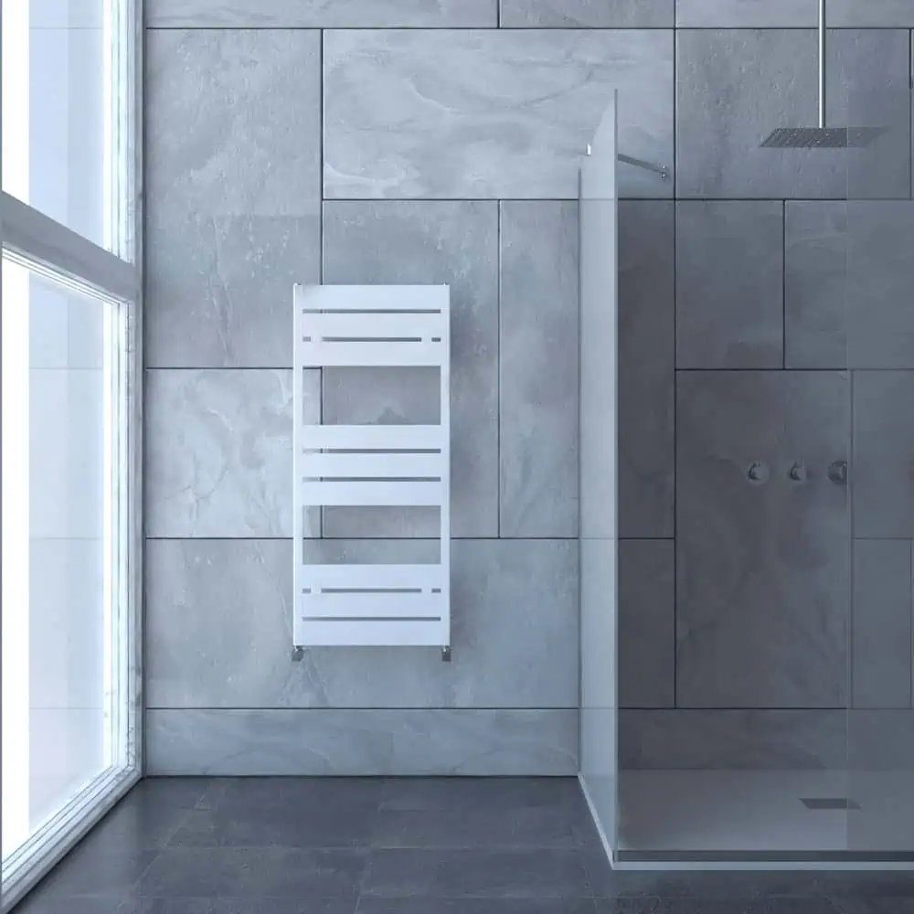 mack-bath-1145x500-1-1200x1200 White modern towel radiator in a contemporary bathroom setting.