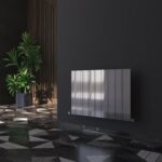Modern black radiator with a sleek design in a stylish interior setting.