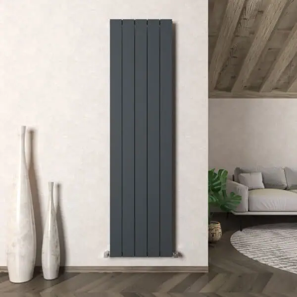Modern vertical black radiator in a contemporary living room setting.