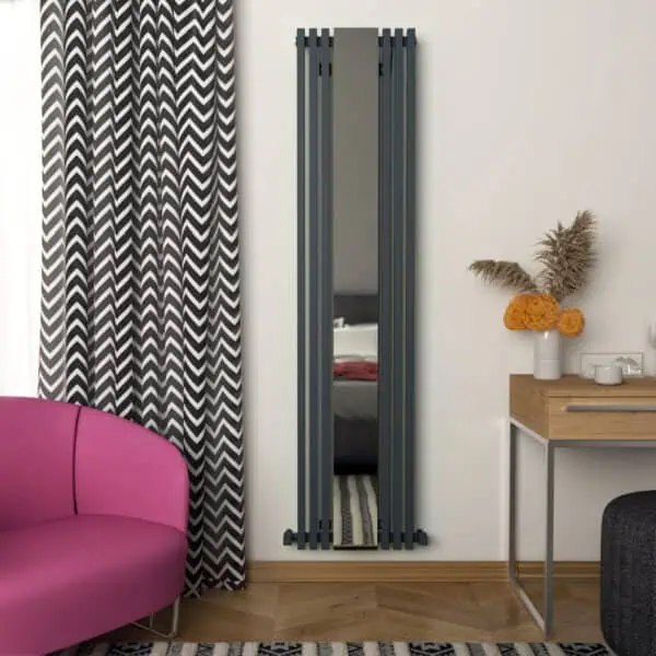 Modern vertical radiator with mirror in stylish interior decor setting.