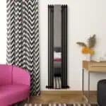 Stylish black metal wall mirror in modern interior decor setting.