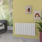 Radiator for home heating with modern design in a cozy living room, wall art, and stylish decor.