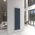 Blue modern radiator heating panel in contemporary home interior.