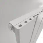 Radiator valve and panel details, clean white heating radiator with adjustable valve.