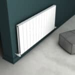 Radiator installation in modern living room, clean white panel radiator on dark wall, heating system, stylish home decor.