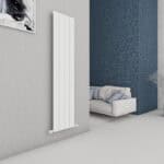 Modern vertical white radiator in a stylish living room setting.