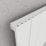 Modern white radiator with adjustable valve for efficient space heating and temperature control.