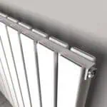 Modern white panel radiator for home heating and interior decor.