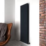 Black modern radiator. Stylish heating solution in contemporary interior design.